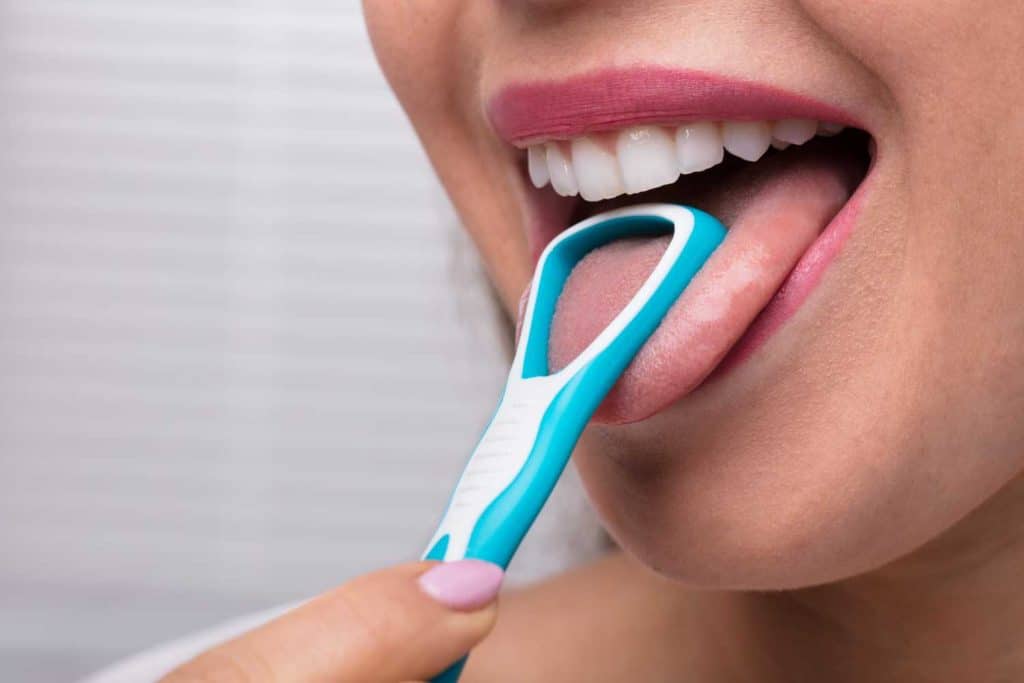 the benefits of using a tongue scraper to improve oral hygiene imperial dental center sugar land dentist 1024x683 1